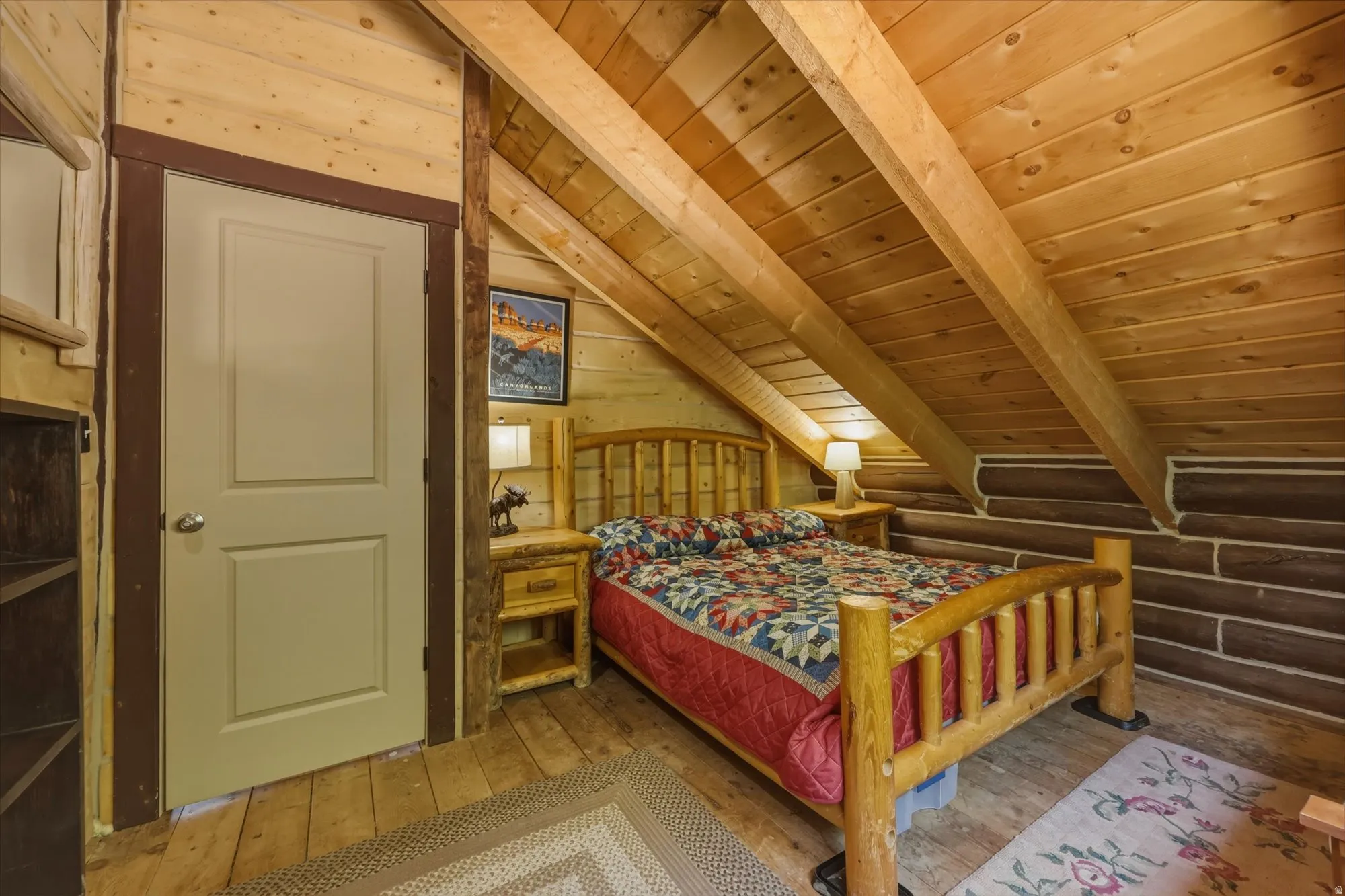 Wood-paneled sloped ceiling with exposed beams