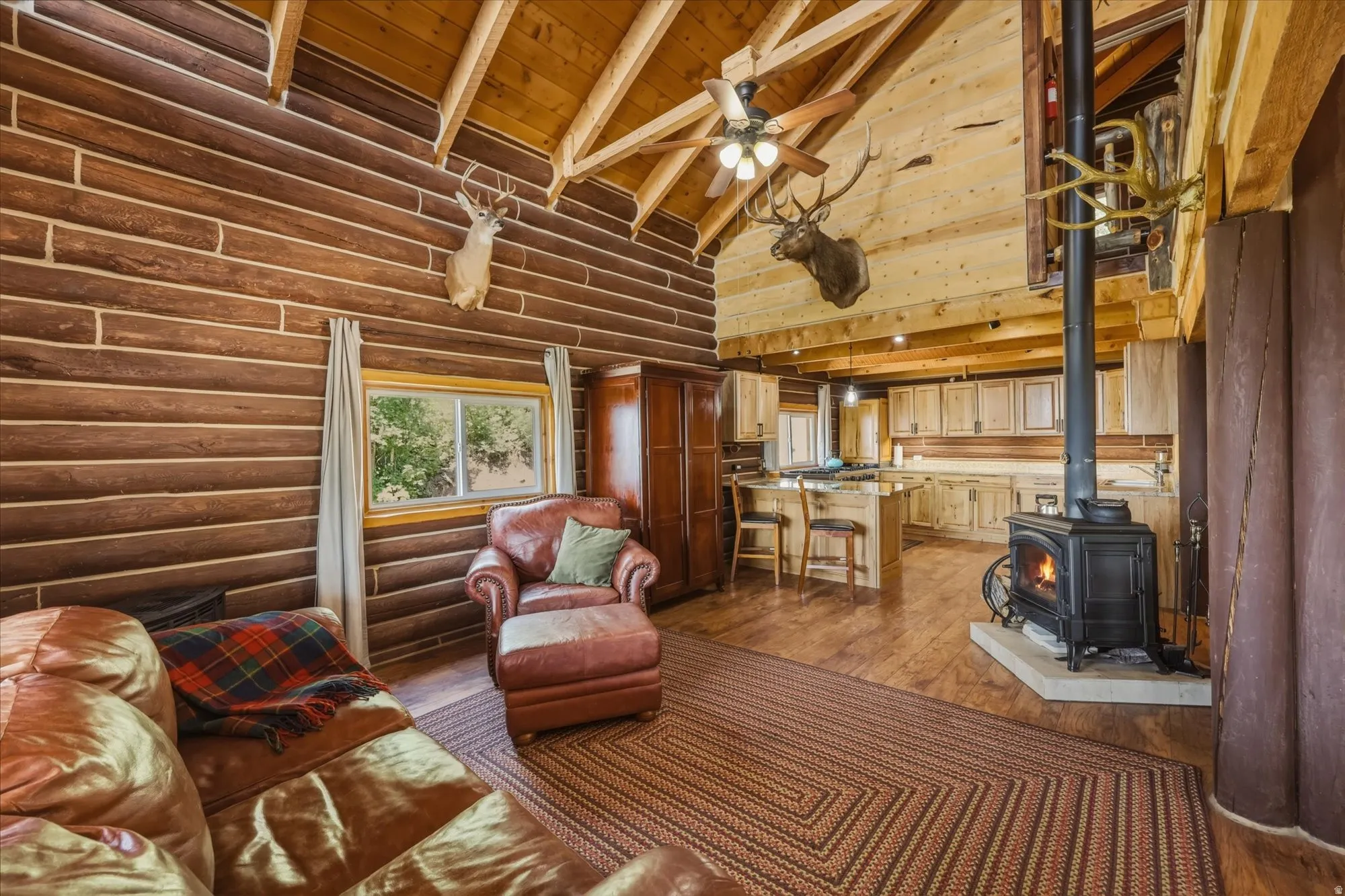 Wood-clad walls and vaulted wood ceilings with exposed beams