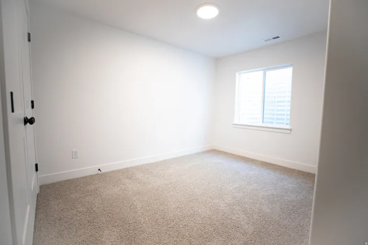 Bedroom #3 with large closet in fully finished basement.