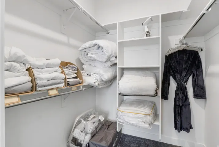 Built-in shelving and hanging rods provide ample storage