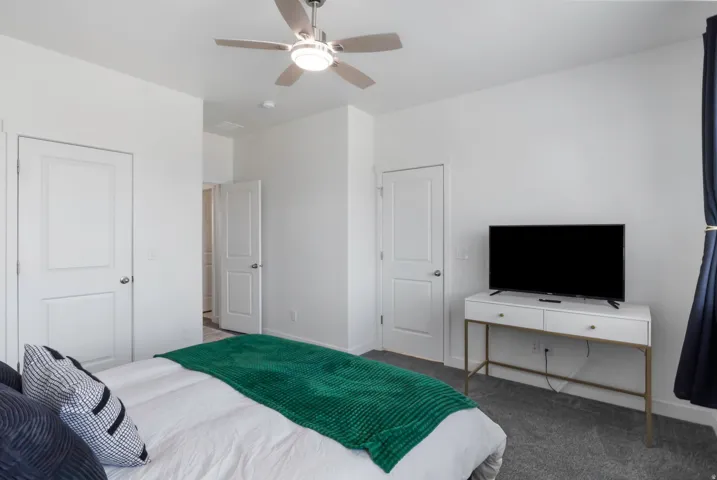 Recessed lighting, ceiling fan with light fixture, white interior doors, and gray carpet