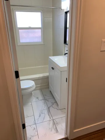 White tile flooring with veining