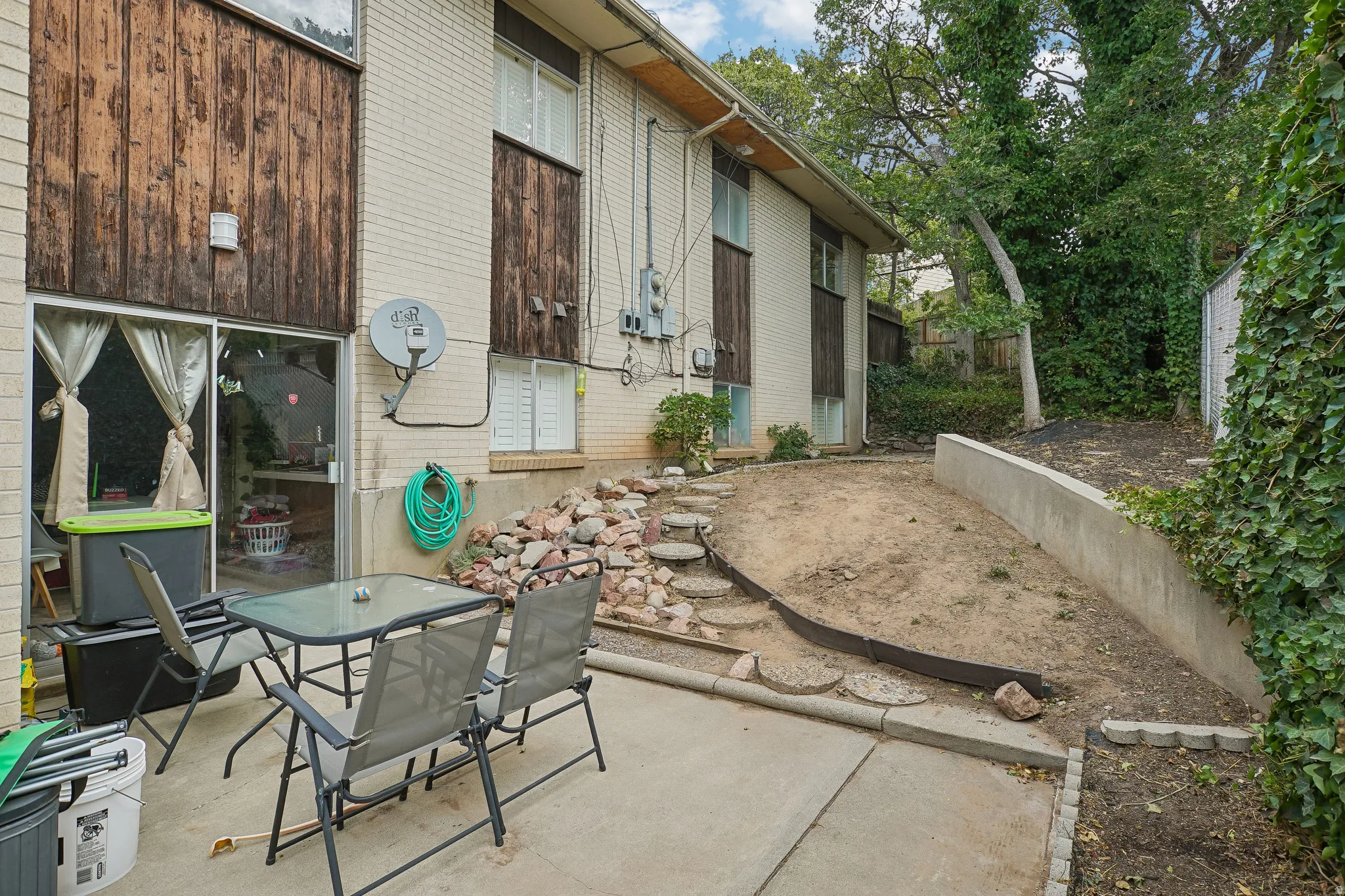 Concrete patio with direct access to interior via sliding glass door
