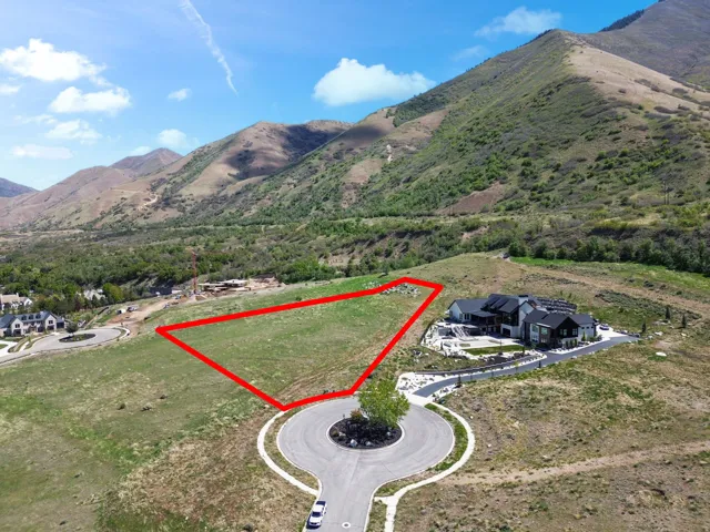 Expansive land parcel with surrounding mountains