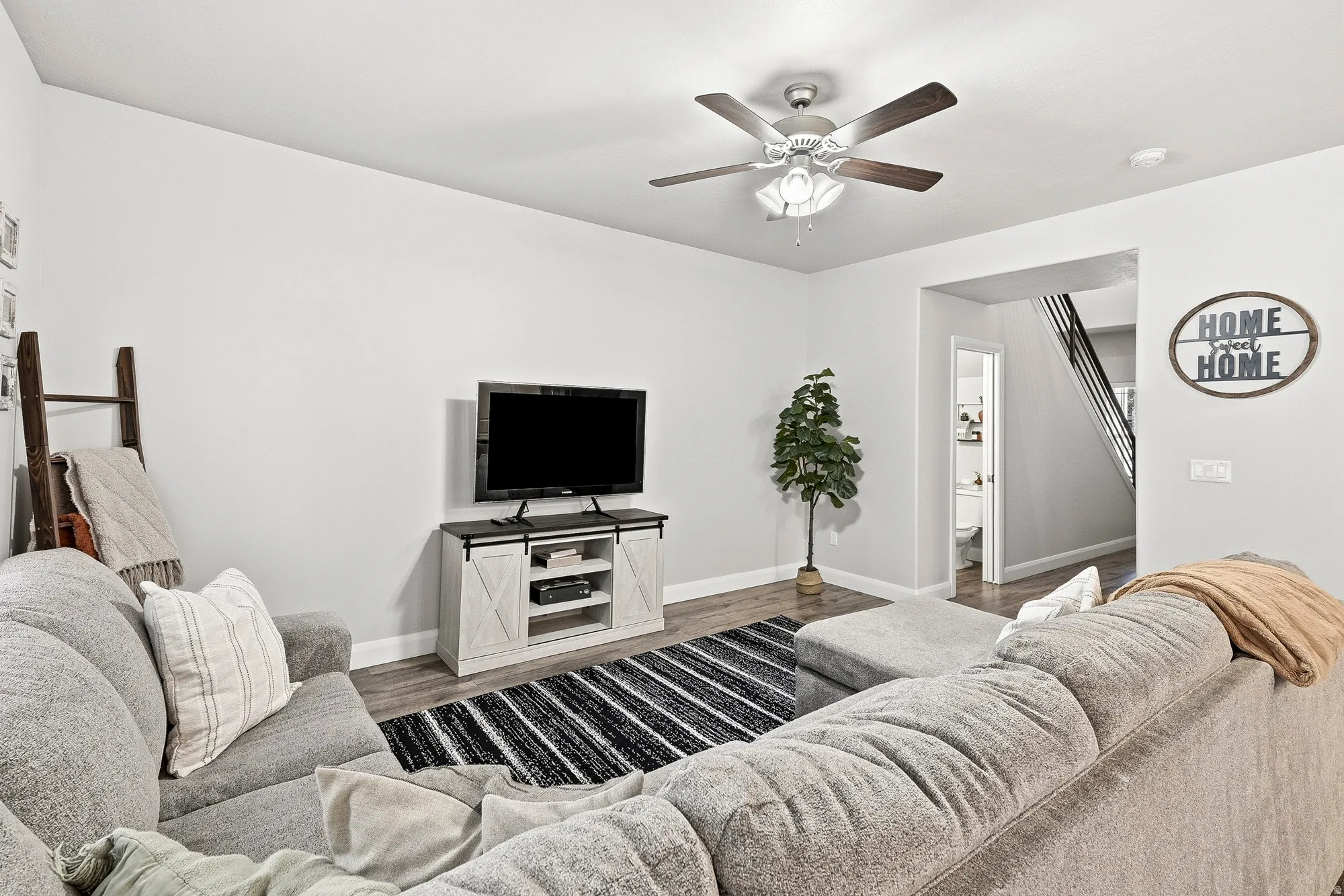 Recessed lighting, wood-finish flooring, ceiling fan, and painted walls