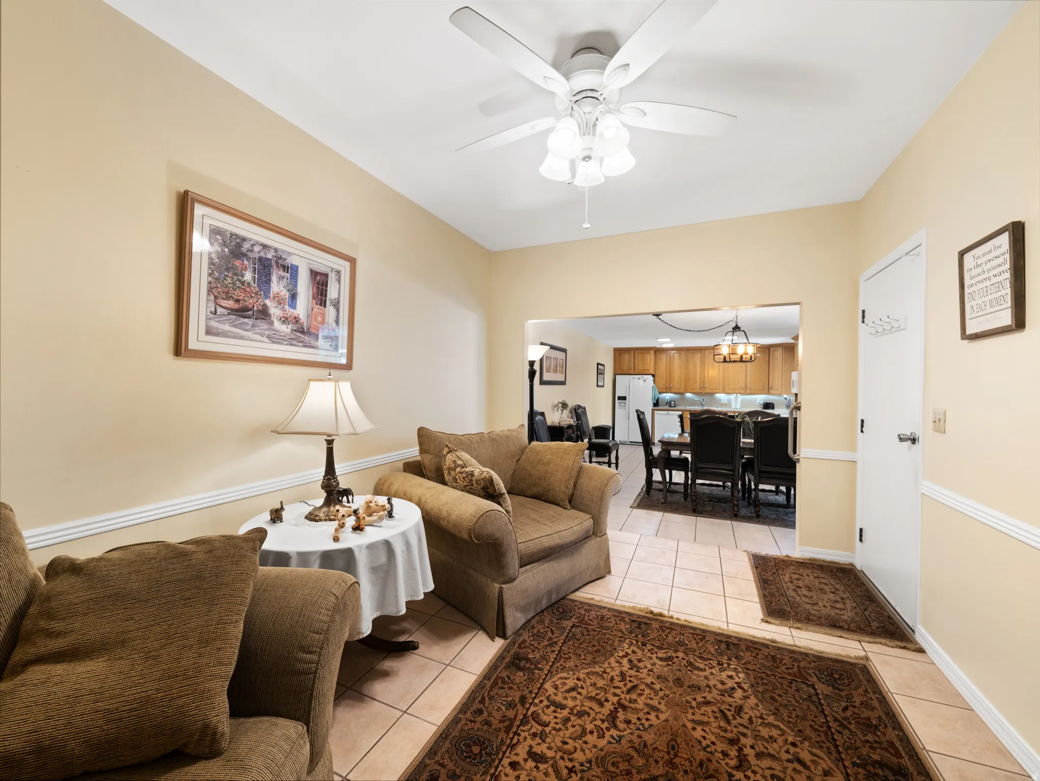 Recessed lighting, ceiling fan, crown molding, tile flooring, and an open concept layout