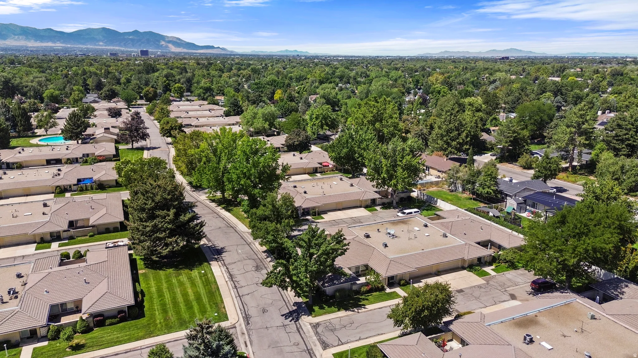 Community features a swimming pool and mature trees