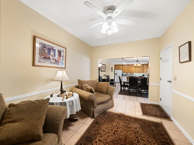 Recessed lighting, ceiling fan, crown molding, tile flooring, and an open concept layout