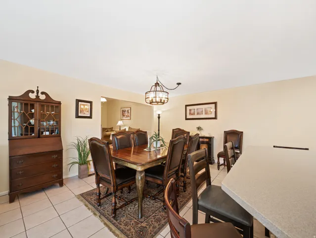 Recessed ceiling, neutral wall paint, tile flooring, and an open concept layout
