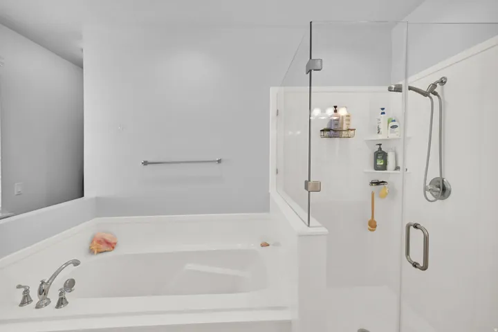 Soaking tub with deck-mounted faucet and handheld showerhead