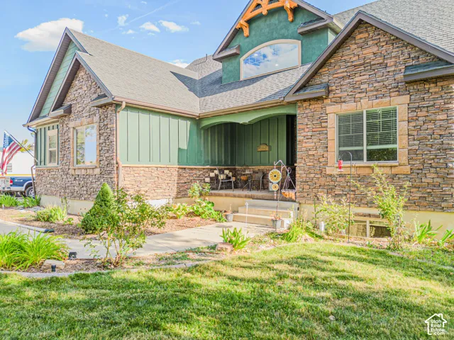 Stone veneer and board-and-batten siding exterior with a covered porch