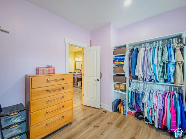 Built-in closet organization system with shelving and hanging rods