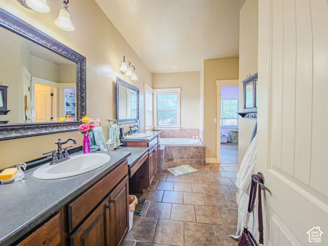 Dual vanities with undermount sinks and dark wood cabinetry