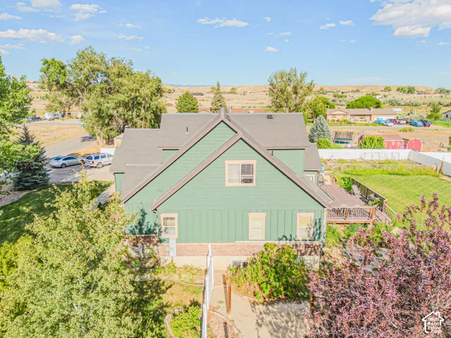 Gable roof design with green shingle siding and dark trim