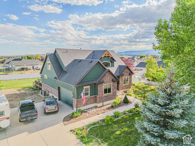 Craftsman-style exterior with stone and siding accents