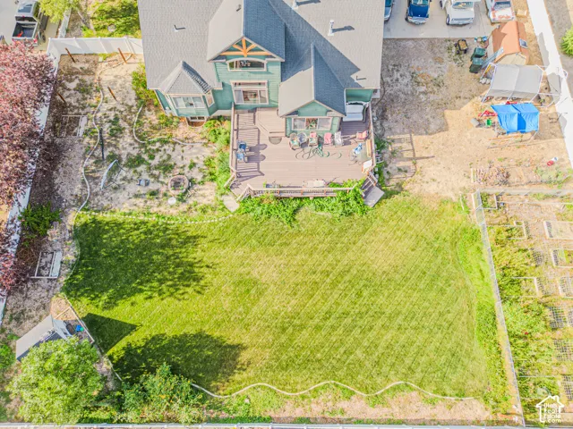 Expansive manicured lawn with mature tree coverage, offering substantial outdoor space