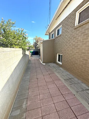 Paved walkway featuring red and gray pavers