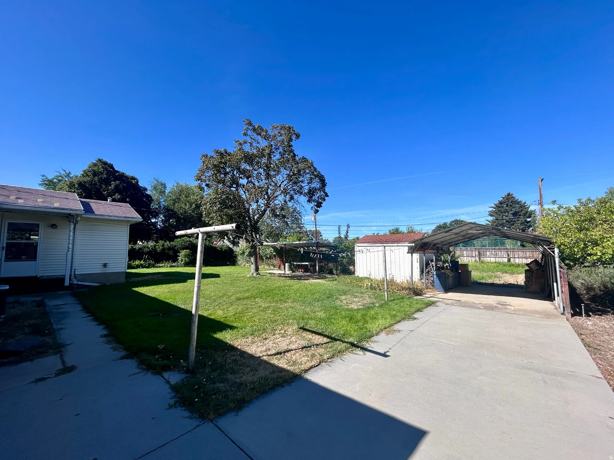 Extra long driveway with carport at the back for additional parking