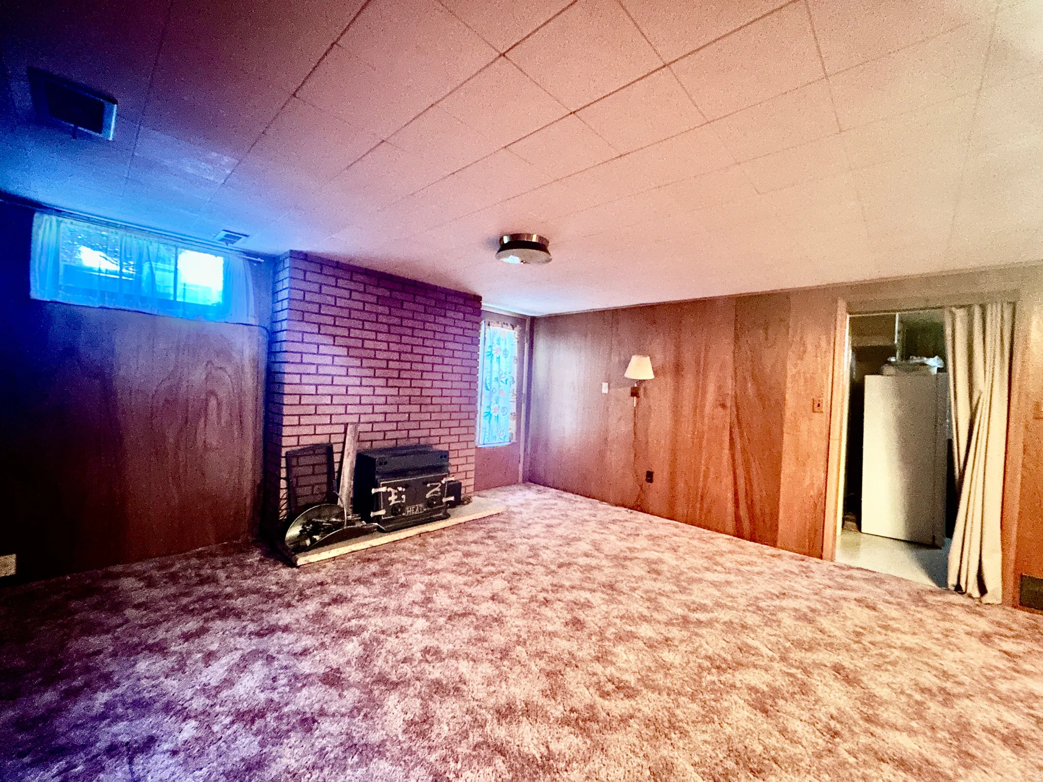 Large family room in the basement with outside entrance