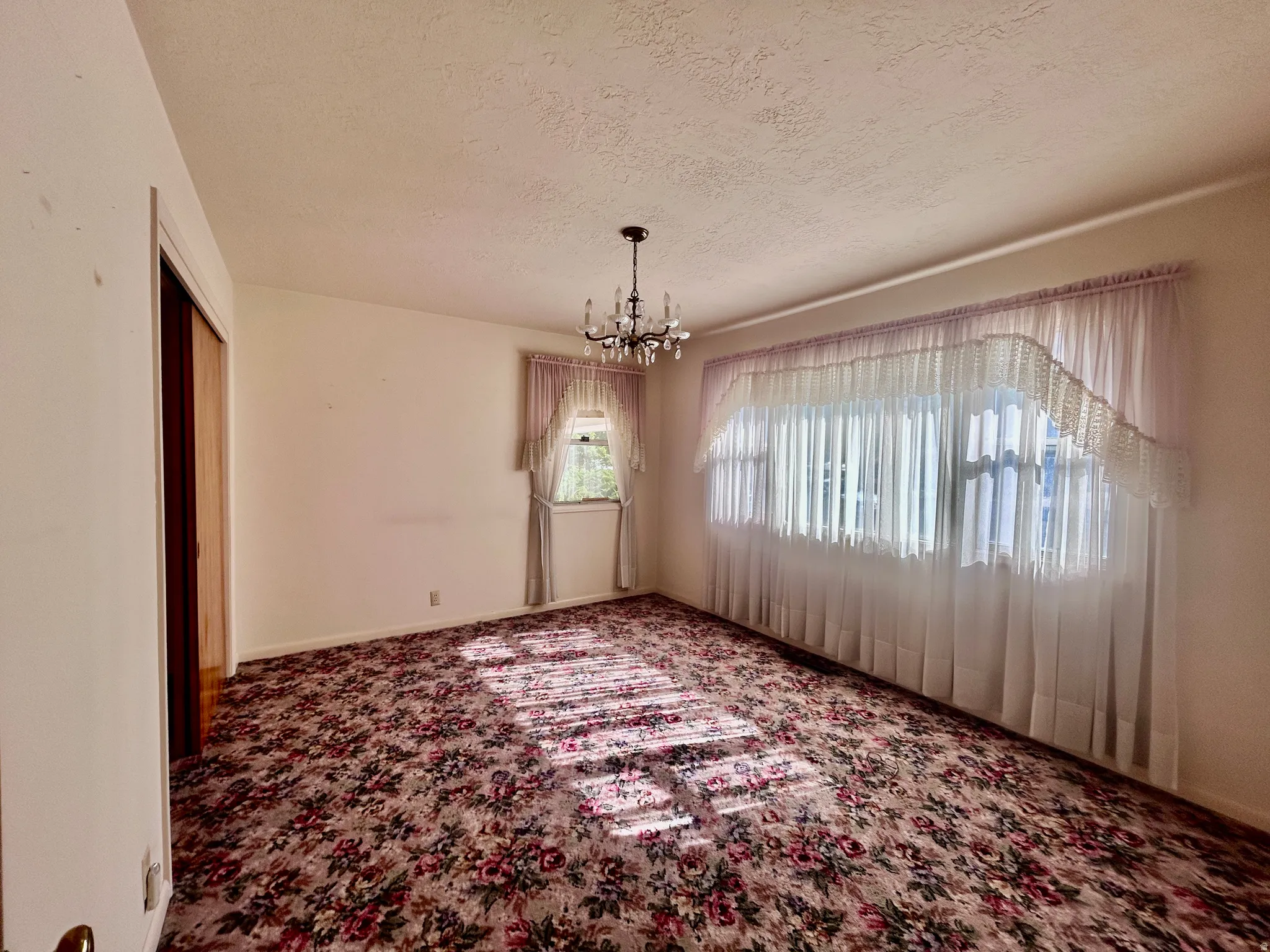 First bedroom with large windows to let in the morning sun