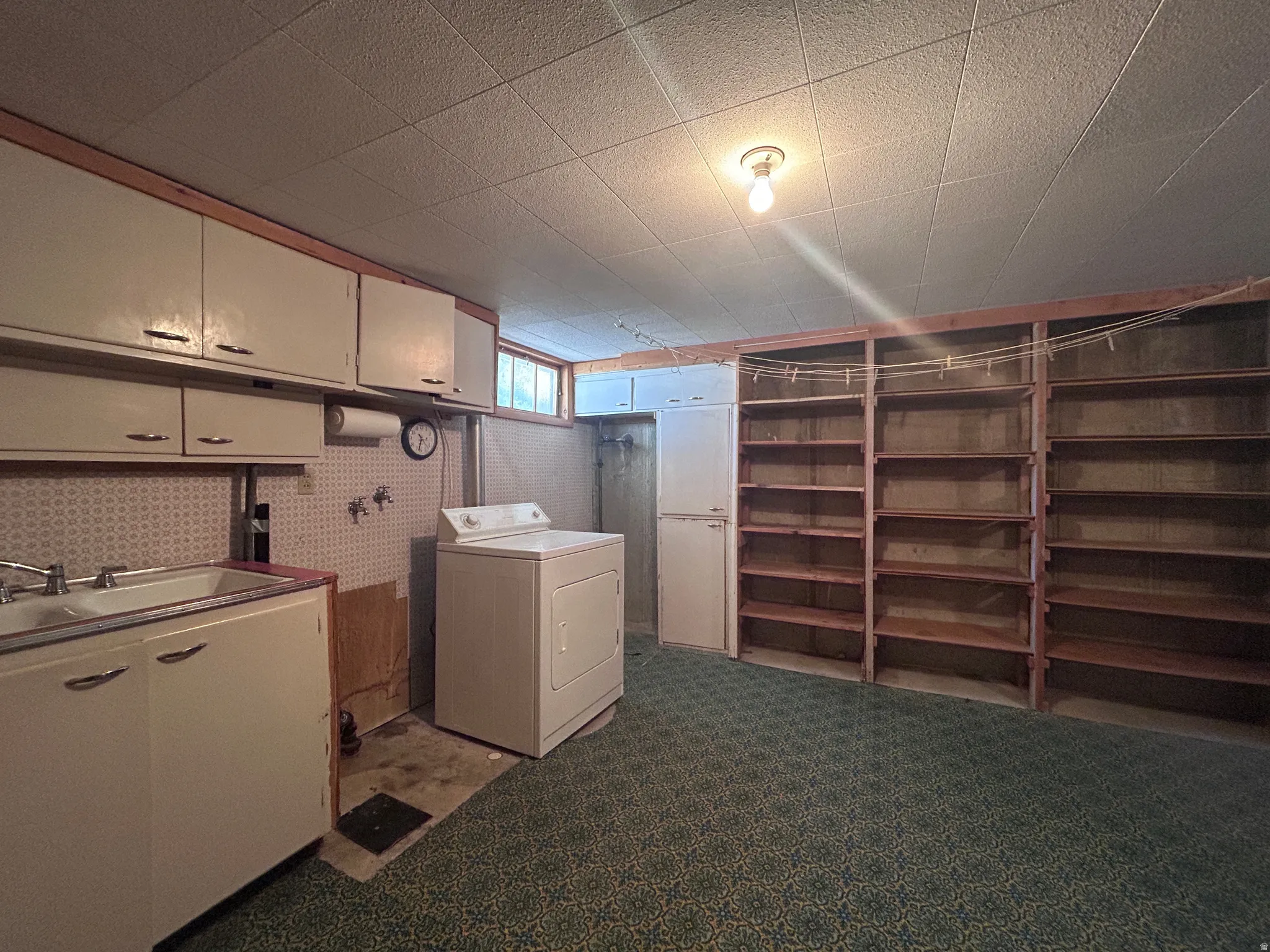 Large laundry room with sink and lots of storage