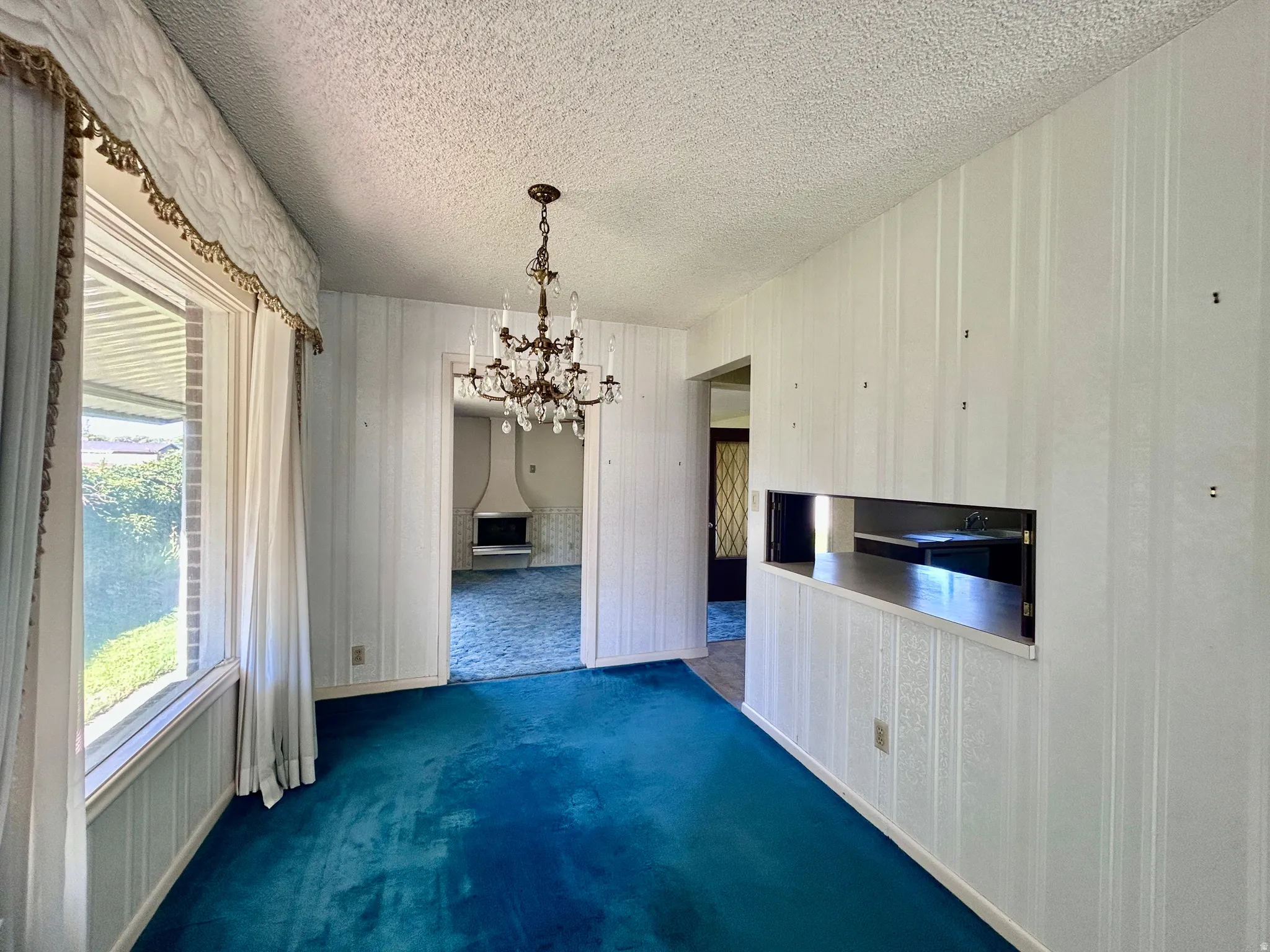 Dining area with "pass-through" window into the kitchen for convenient serving