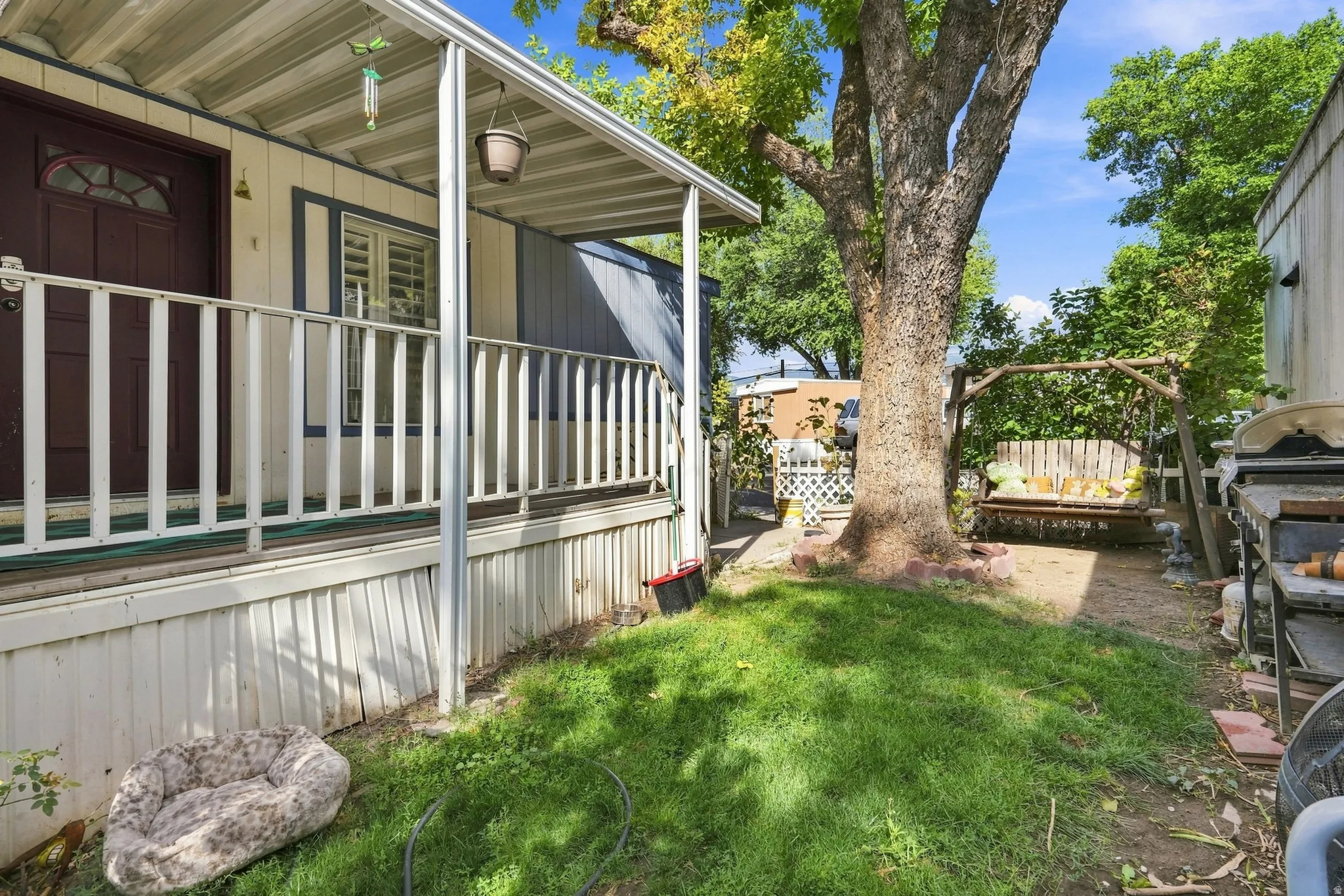 Covered front porch with white railing