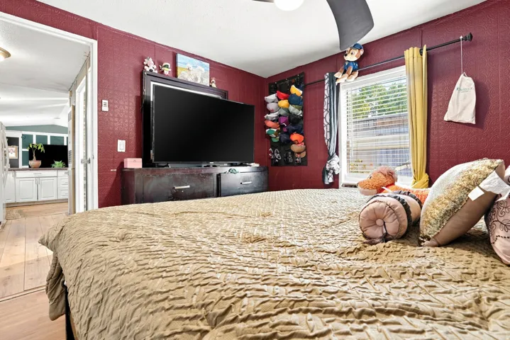 Recessed lighting, wood-finish flooring, and a ceiling fan with light fixture