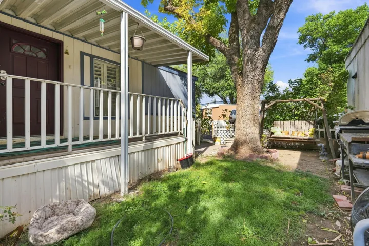 Covered front porch with white railing