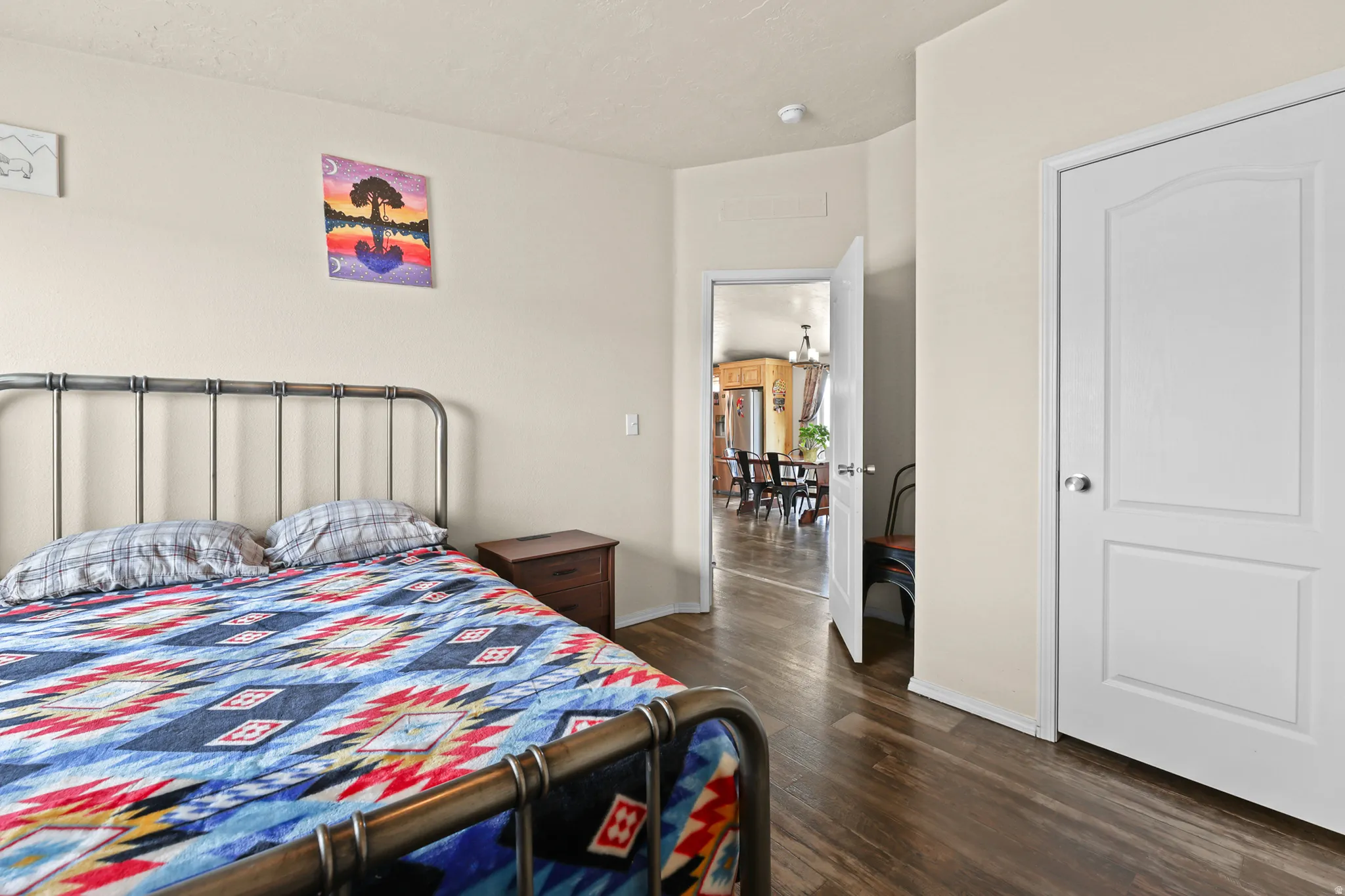 Hardwood-finish flooring, white paneled interior doors, and neutral wall tones