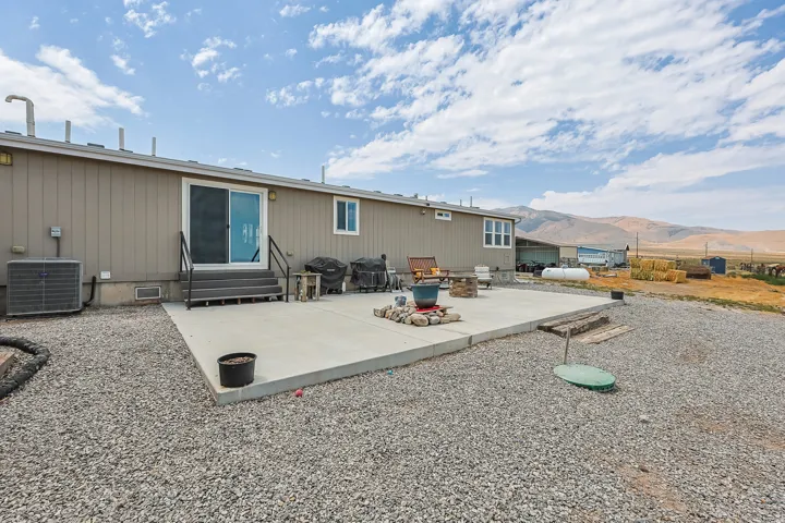Expansive concrete patio with direct access to interior via sliding glass door