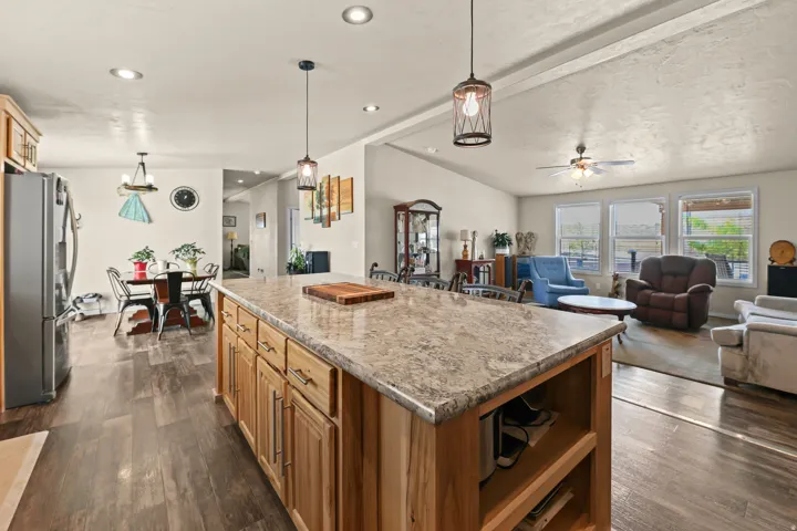 Kitchen island with stone-finish countertop and built-in storage