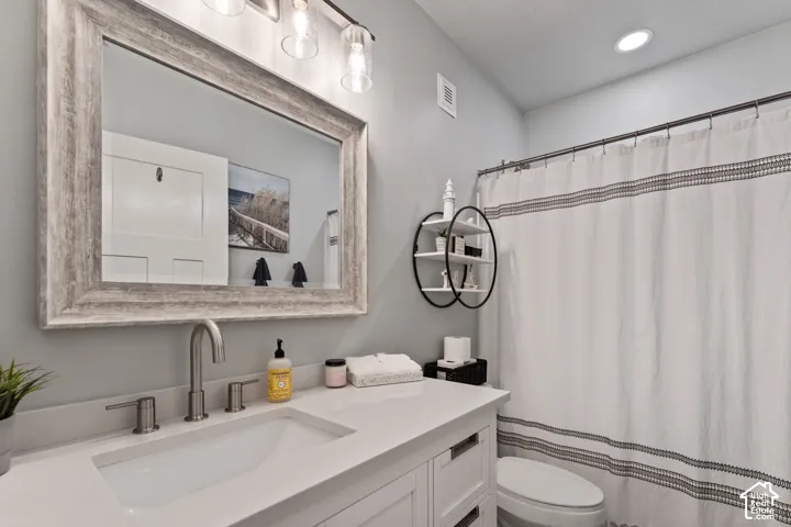 Light gray walls with a framed vanity mirror