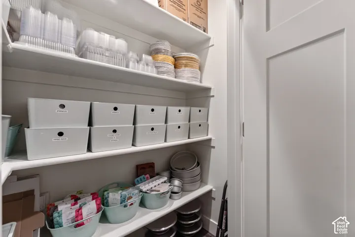Built-in white shelving providing ample storage