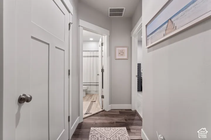 Wood-finish flooring throughout the hallway