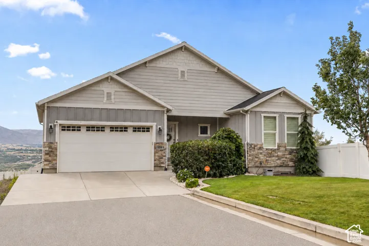 Gray siding and stone exterior with white trim