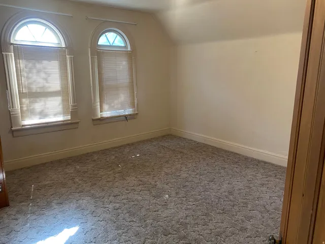 Arched windows with decorative trim