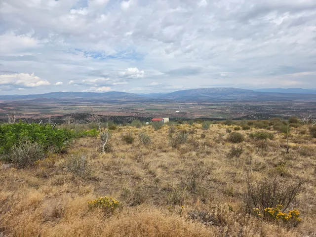 Expansive natural landscape featuring rolling hills, distant mountains, and a beautiful view!