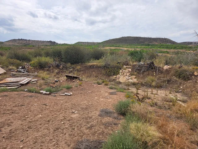 Expansive natural landscape featuring rolling hills, distant mountains, and a beautiful view!