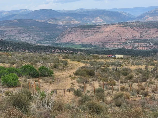 Expansive natural landscape featuring rolling hills, distant mountains, and a beautiful view!