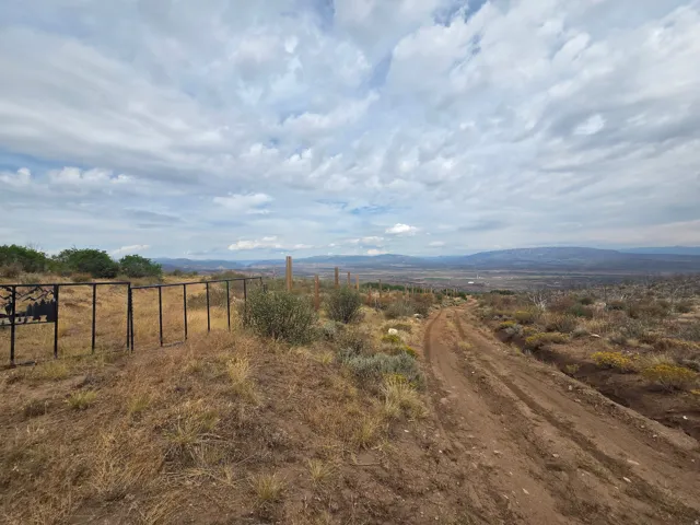 Expansive natural landscape featuring rolling hills, distant mountains, and a beautiful view!