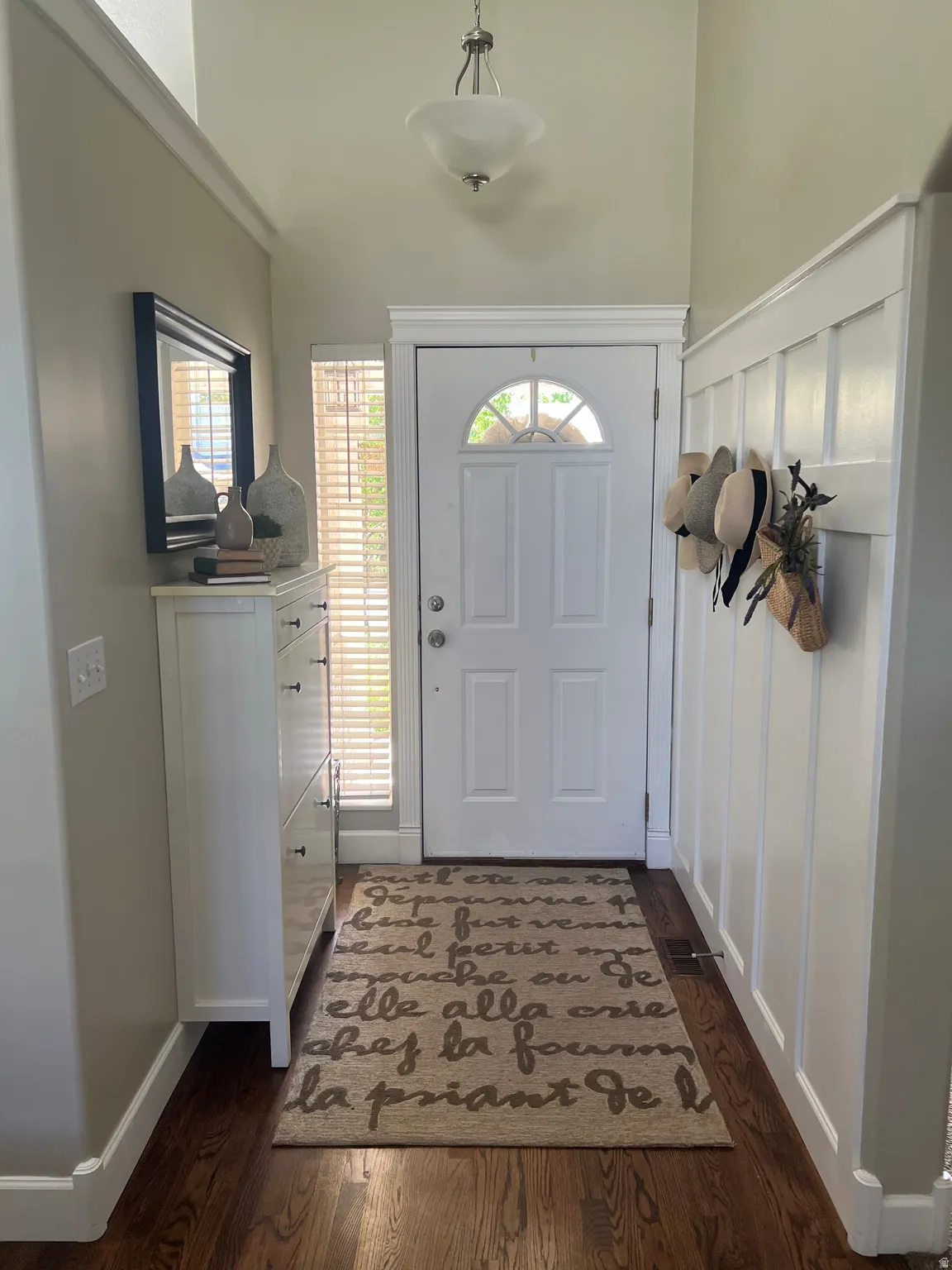 Vaulted ceiling with a pendant light fixture