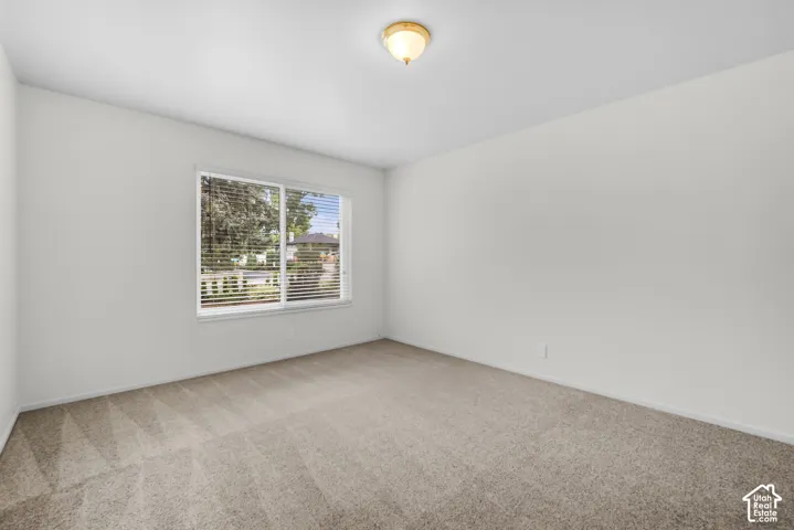 Neutral color palette with broadloom carpet and white painted walls