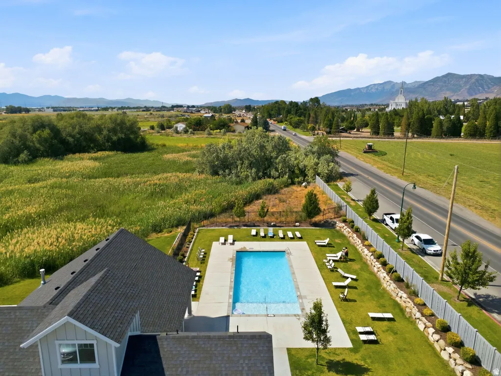 Community swimming pool with a surrounding lawn