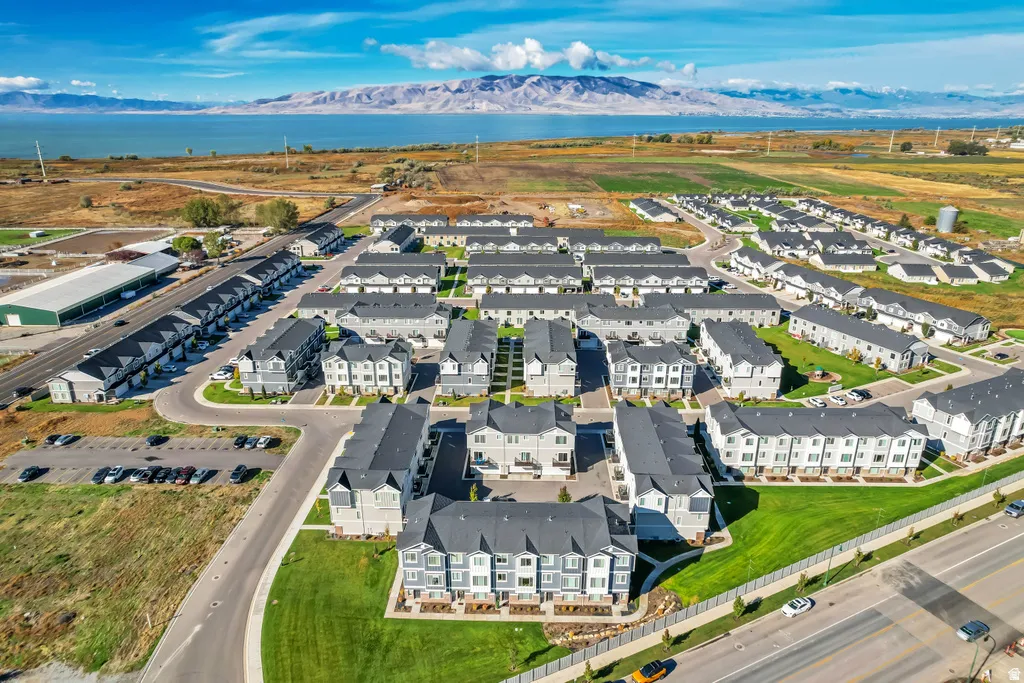 Townhome community featuring a lakefront setting and mountain backdrop
