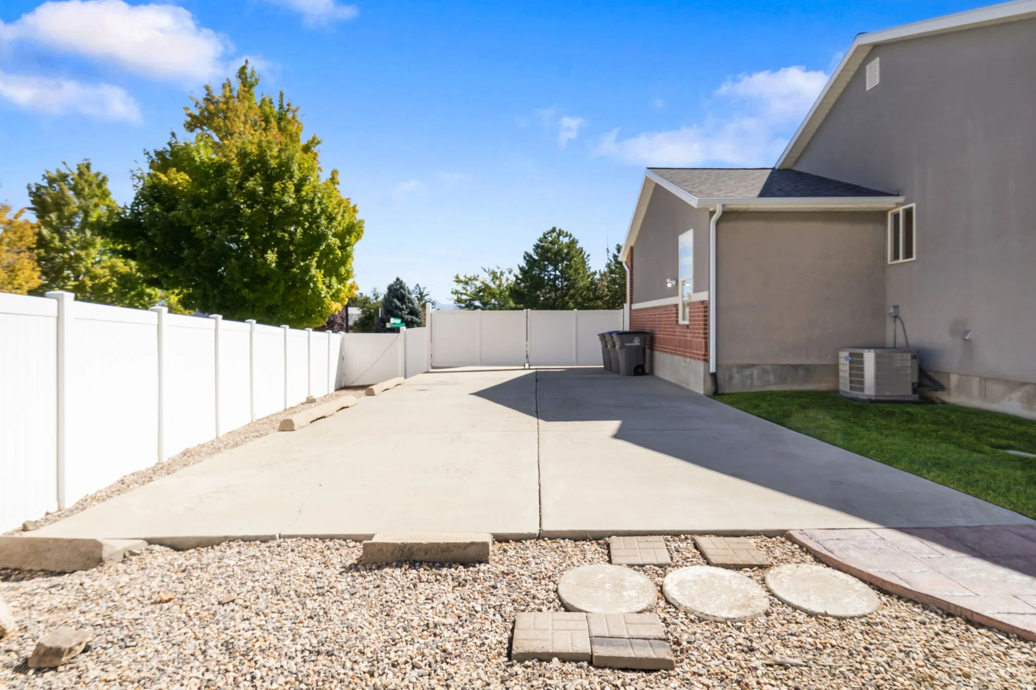 Concrete patio with gravel landscaping