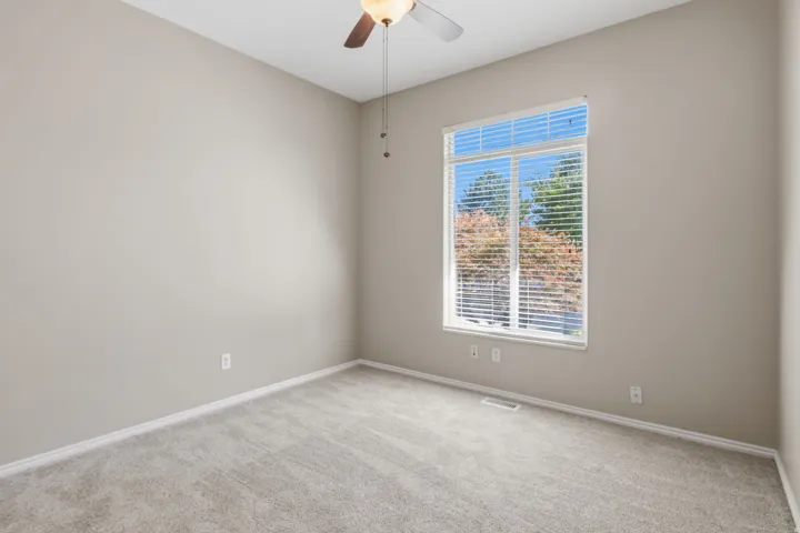 Neutral-toned walls and plush carpet flooring