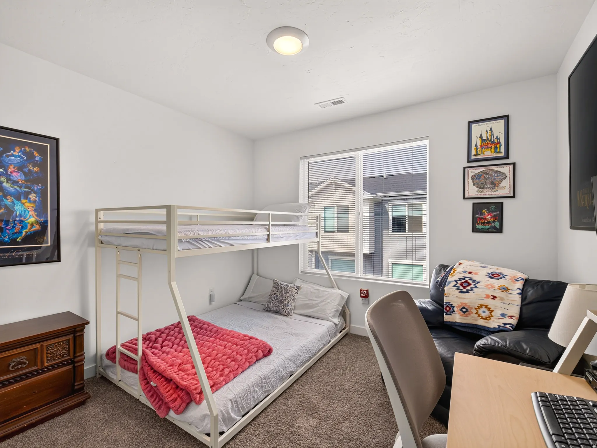 White walls and light-colored carpet provide a neutral palette