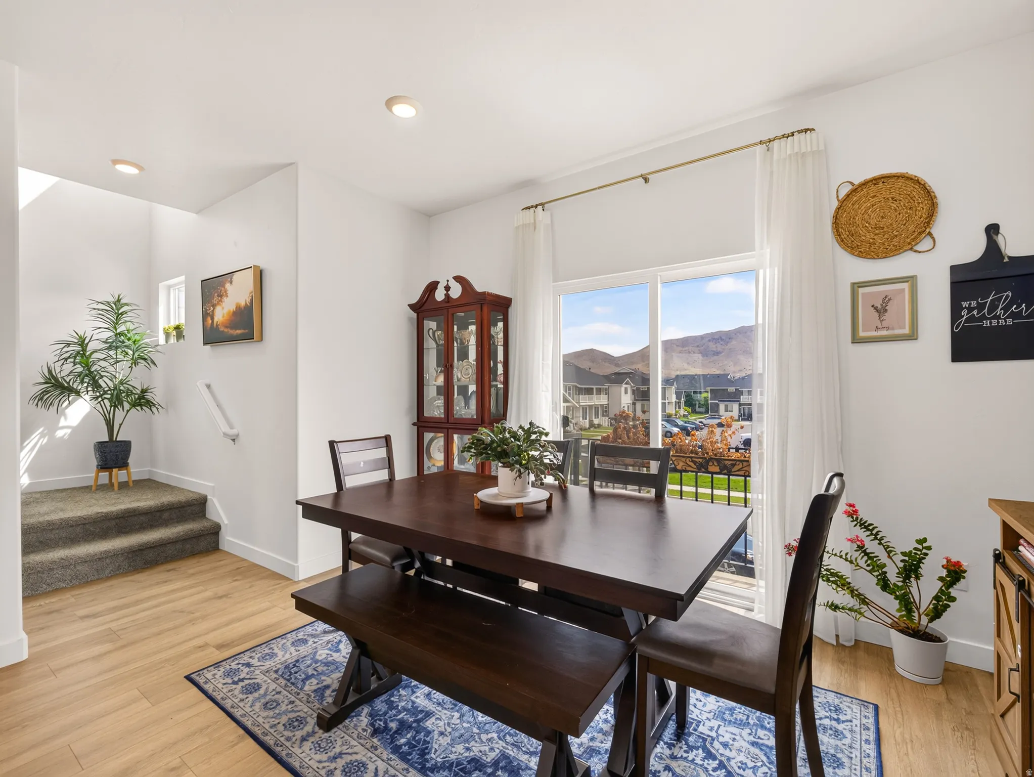 Wood-finish flooring, recessed lighting, and a large sliding glass door