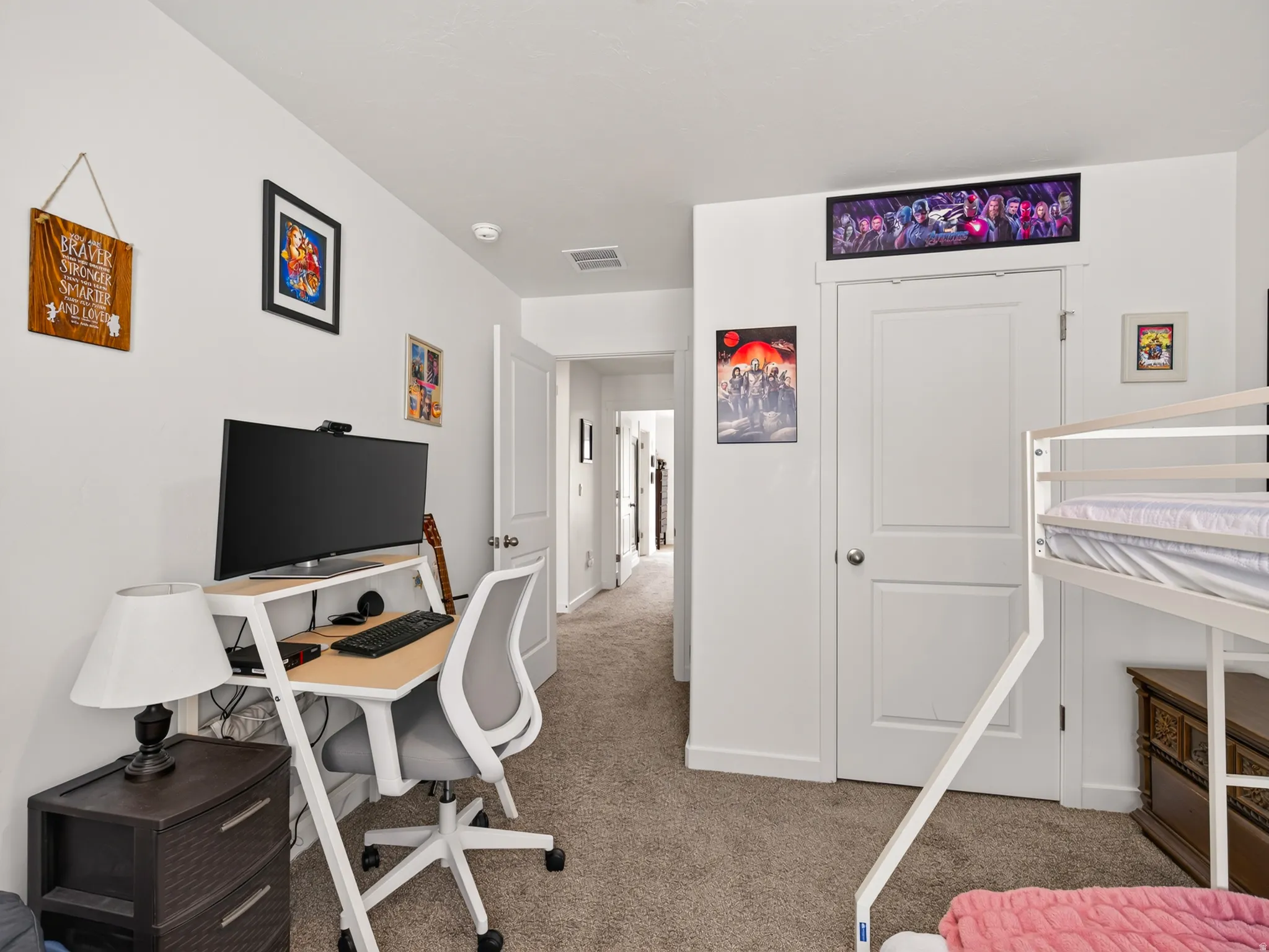 Carpeted flooring, white walls, and white interior doors